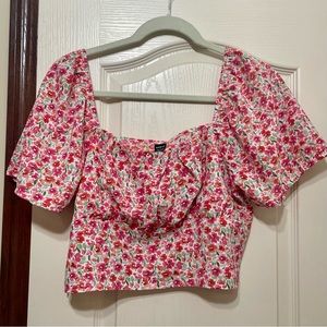 Fun floral crop top with balloon arms and side zipper closure